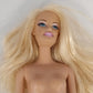 Mattel Barbie doll with blonde hair blue eyes and bendable knees