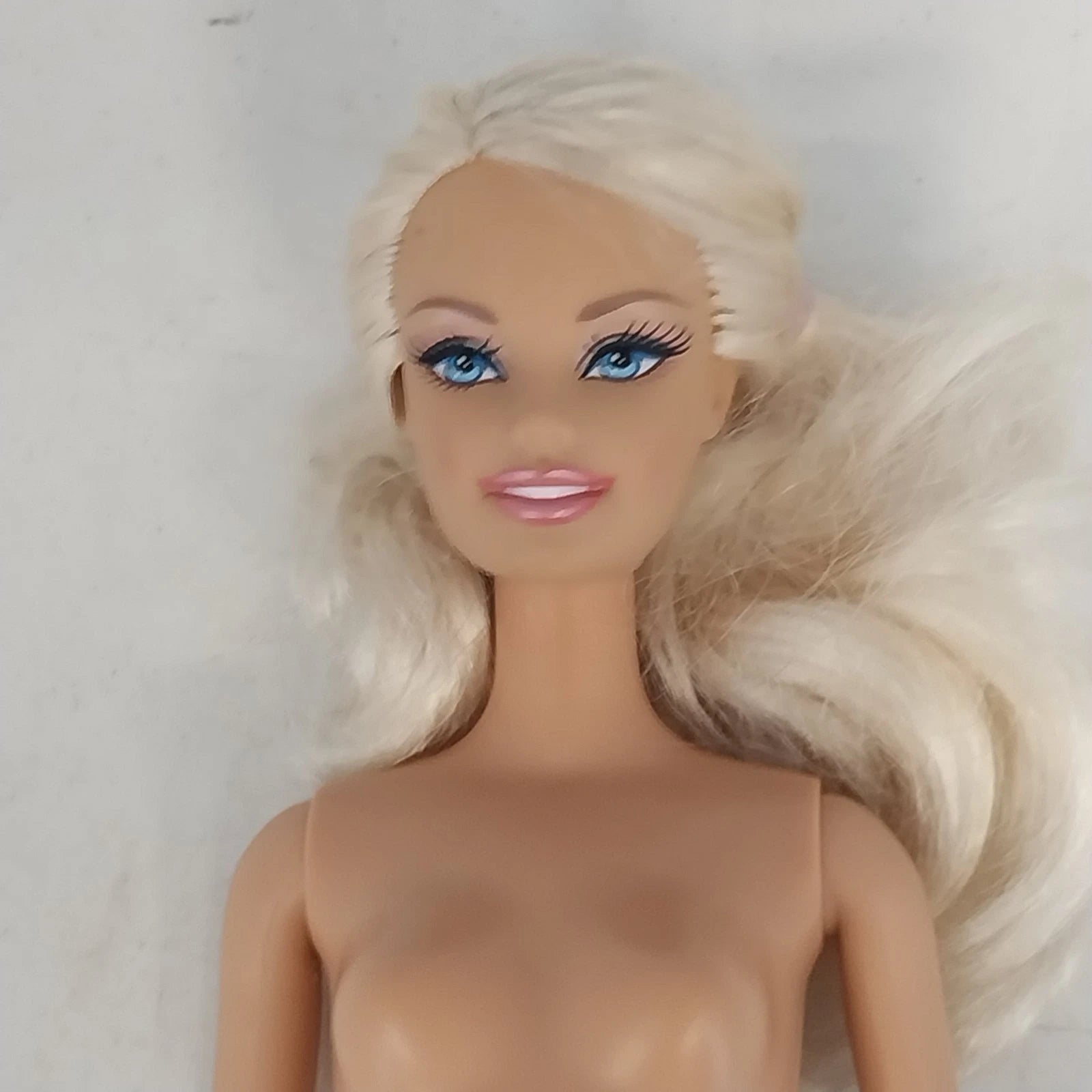 Mattel Barbie doll with light blonde ponytail and bendable knees