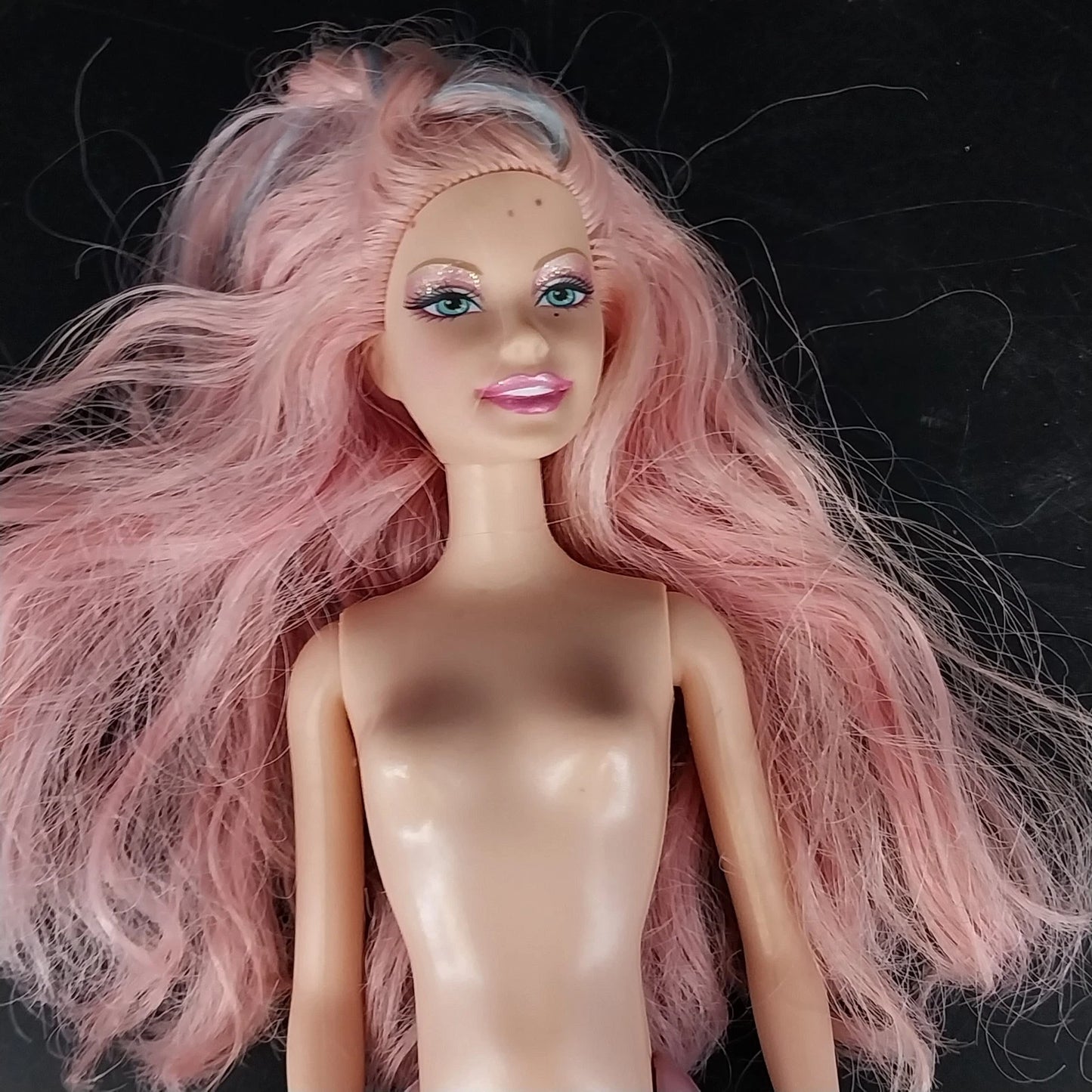 Mattel Barbie mermaid doll with pink hair and blue eyes