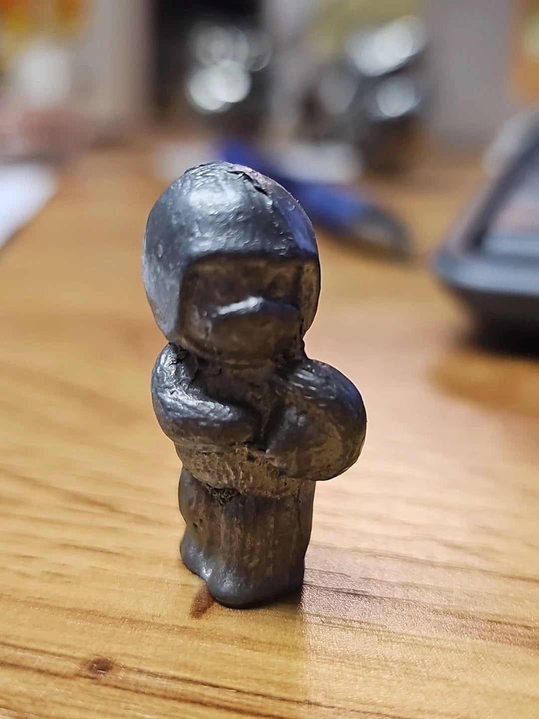 Mini pewter bear figurine dressed as football player holding ball