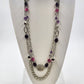 Silver tone double strand necklace with multicolor beads and filigree accents