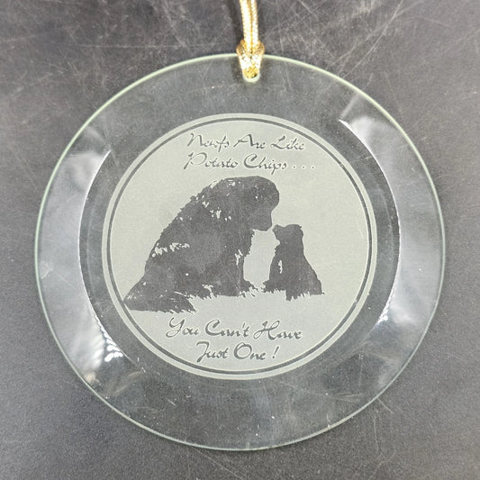 Round etched glass Newfoundland dog ornament featuring an adult dog and puppy with a gold-tone hanging cord