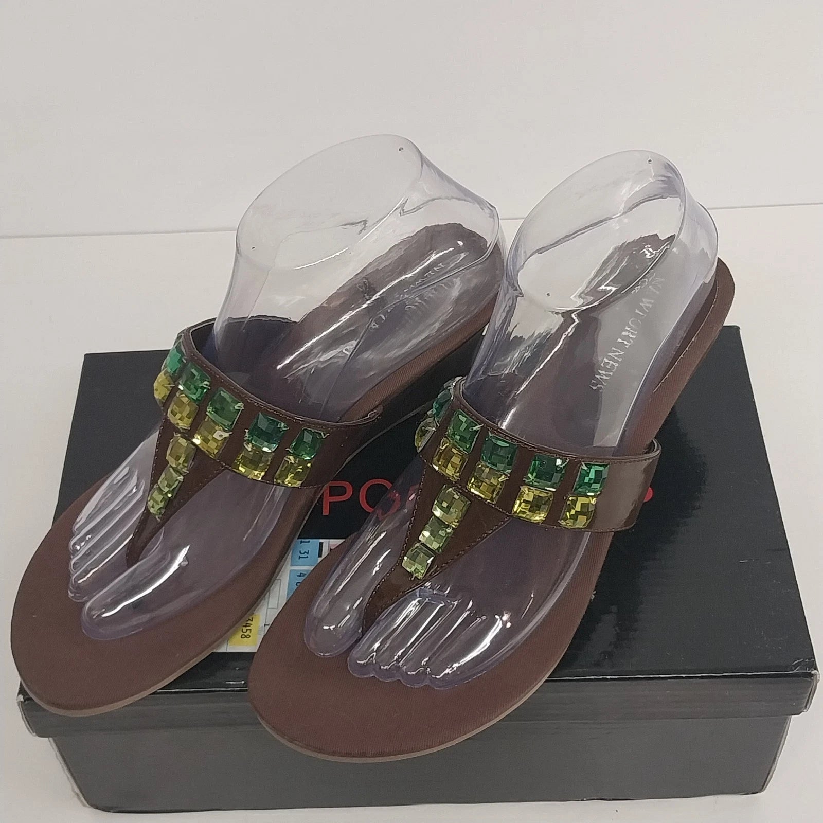 Brown Newport News thong slide sandals with rhinestone embellishments