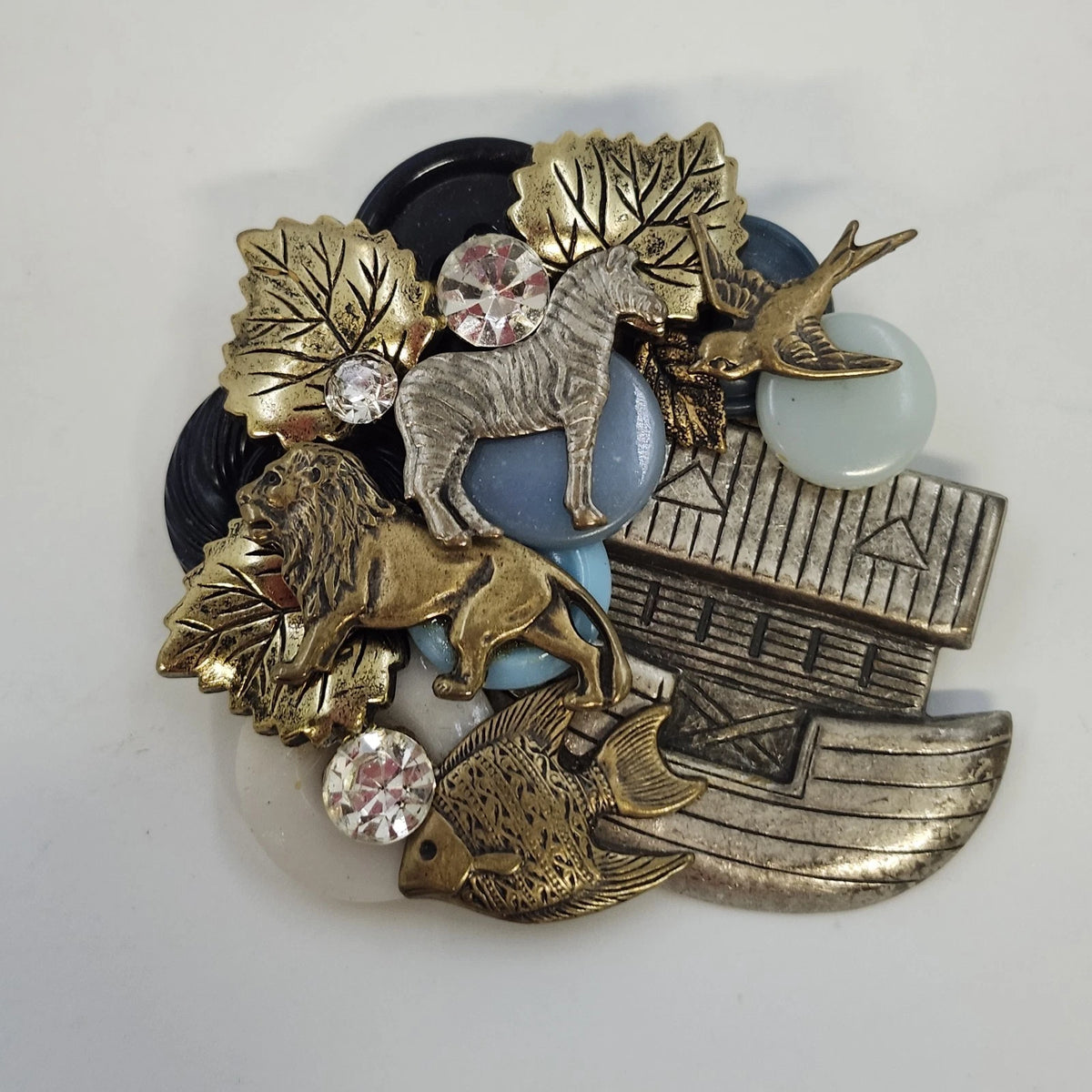 Noah's Ark brooch with lion, zebra, bird, fish, and rhinestones