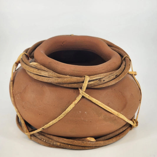 Orange terracotta clay pottery jug vessel with rustic folk art style