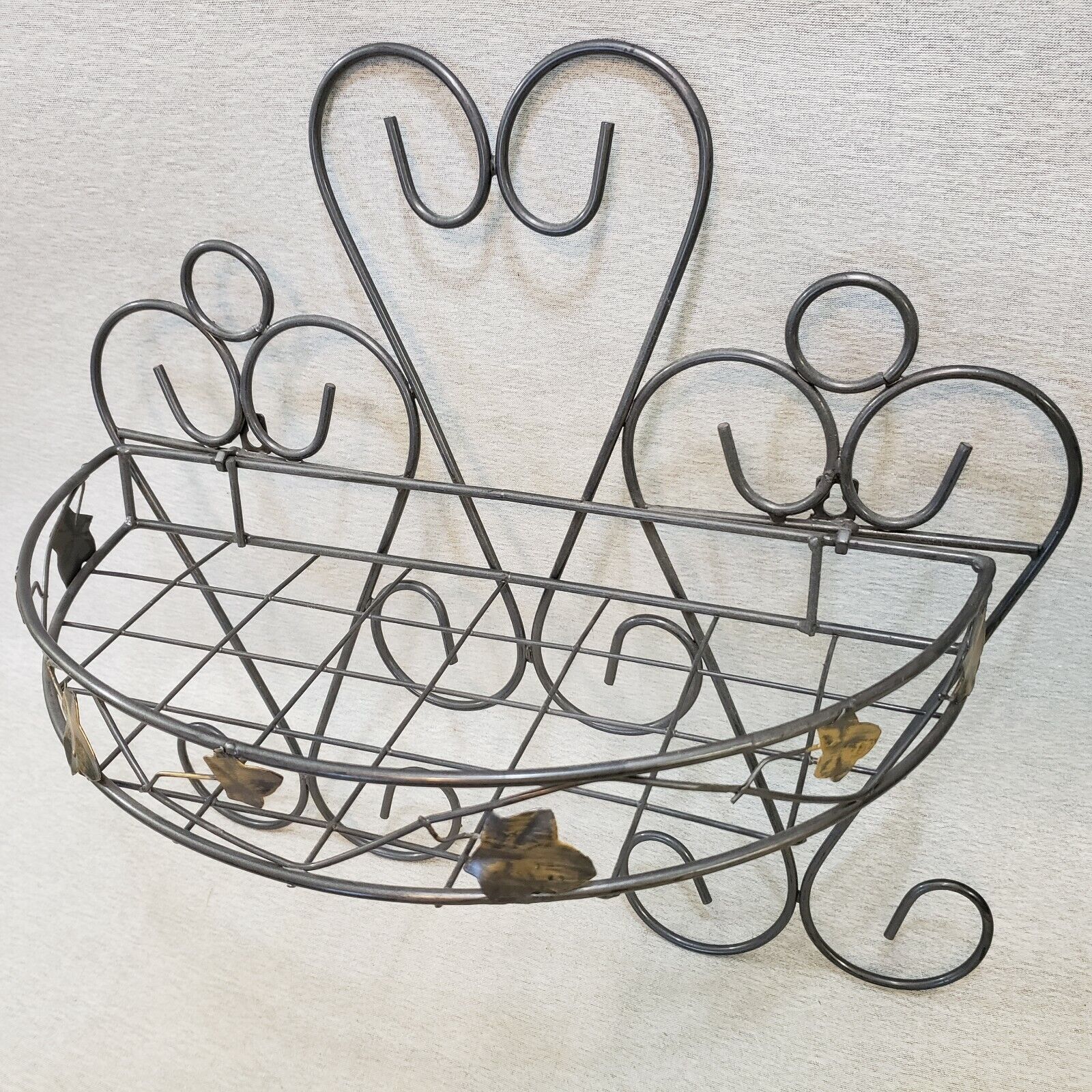 gray welded wire wall shelf basket leaf pattern