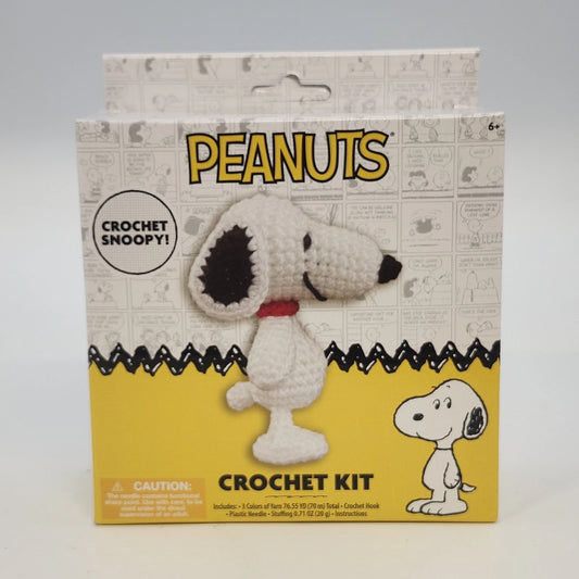 Sealed Peanuts Woodstock crochet kit with yarn, hook, stuffing, and needle