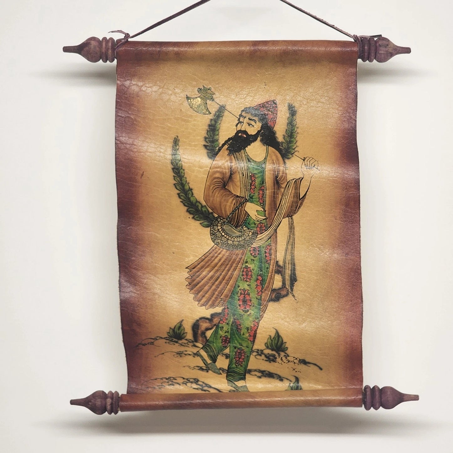 Decorative scroll with a painted figure on a brown background