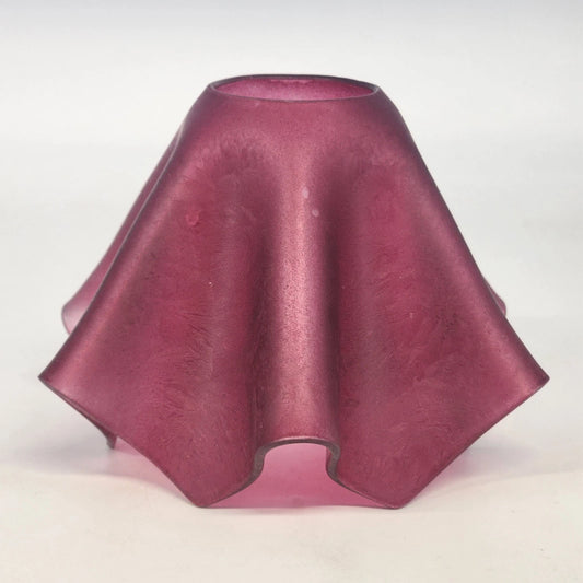 Pink glass shade on a white background