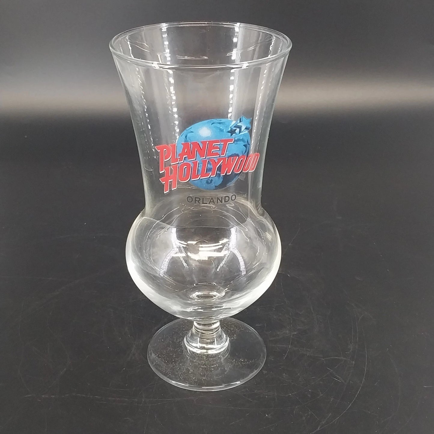 Planet Hollywood Orlando 16 oz hurricane glass with red and blue logo