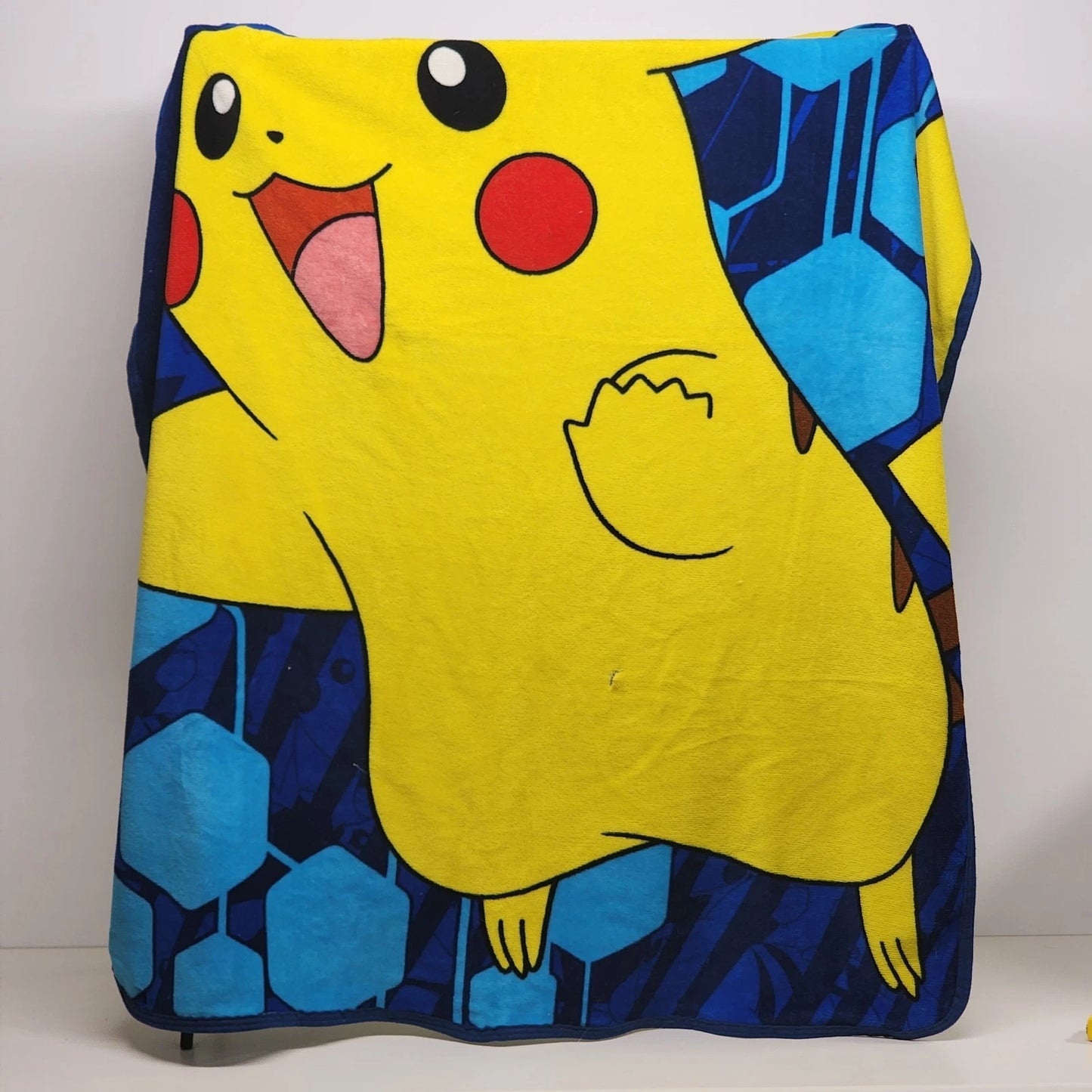Pokemon Pikachu fleece throw blanket with blue geometric design