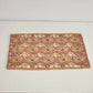 Set of 4 woven raffia sunburst placemats in orange red yellow tones