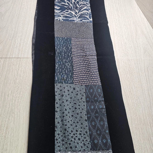 Reversible blue and black patchwork table runner with velvet backing