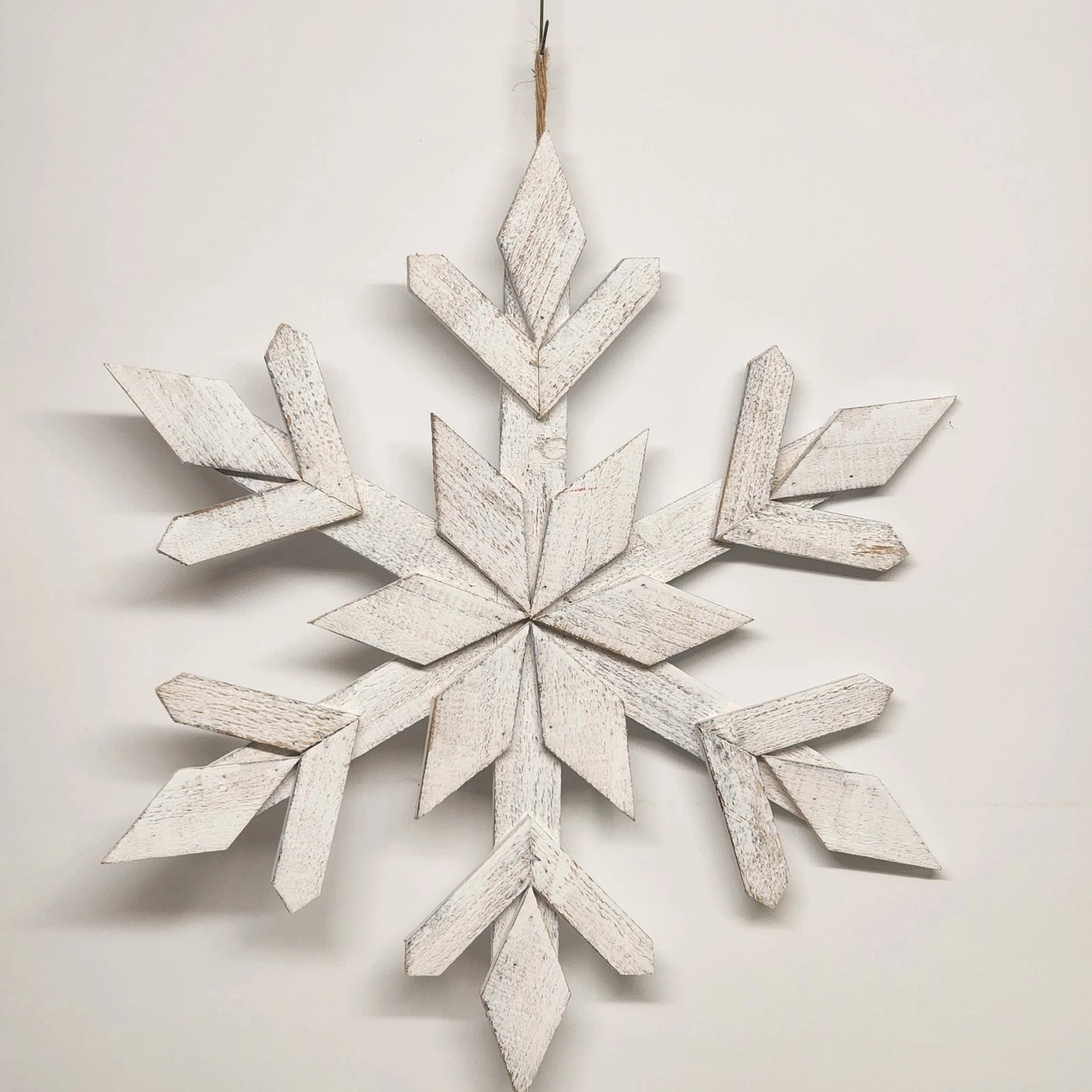 White washed wooden six point snowflake wall decoration