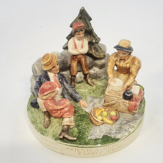 Vintage Sebastian Miniatures ceramic Family Picnic figurine with four hand-painted figures, stone wall, and tree