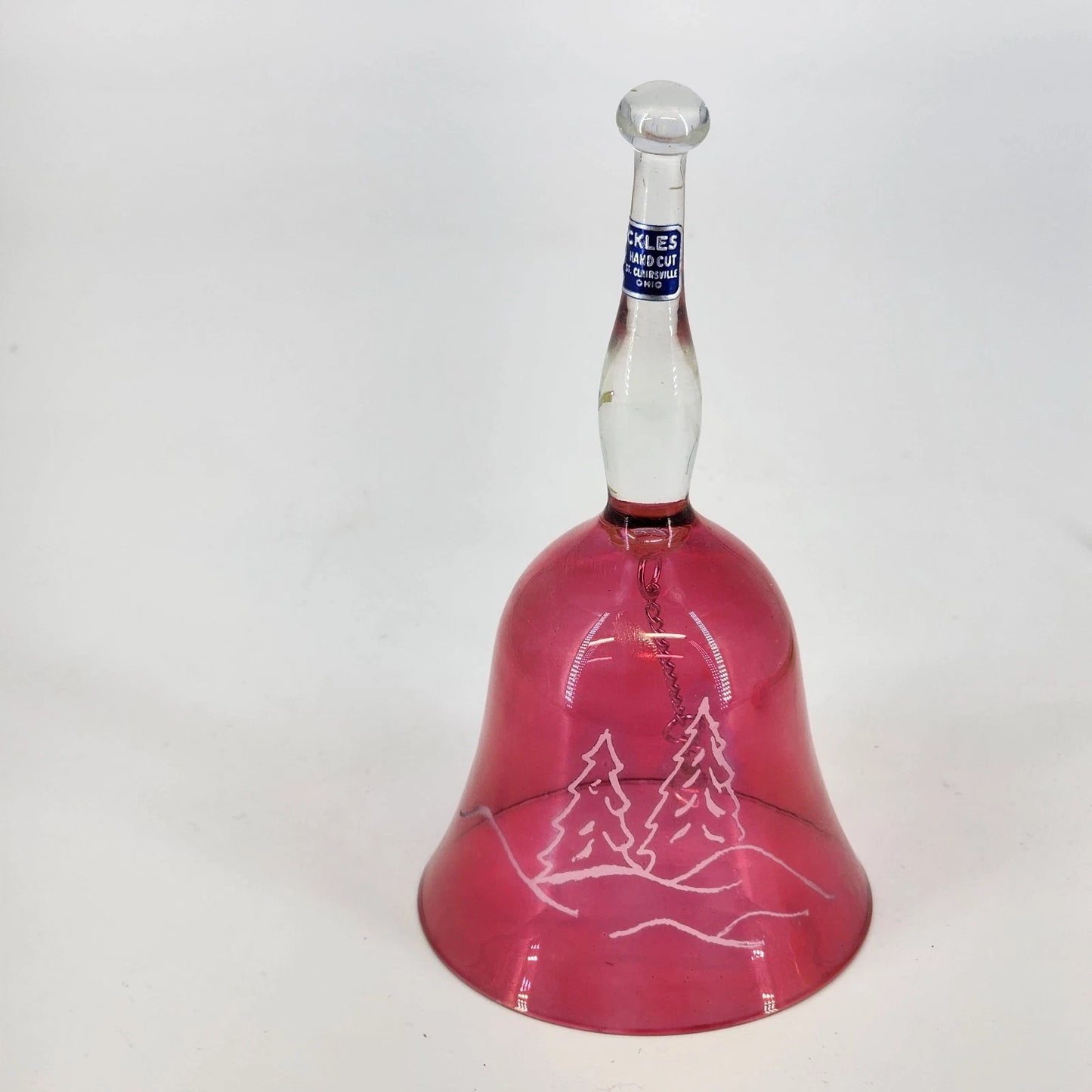 Vintage Sickles cranberry glass bell with etched pine tree winter scene