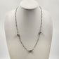 Silver tone bar and link chain necklace with three oval beads