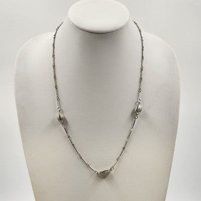 Silver tone bar and link chain necklace with three oval beads