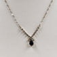 Silver tone necklace with rhinestones and black onyx teardrop pendant