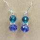 Silver tone dangle earrings with cobalt blue faceted beads and leverback