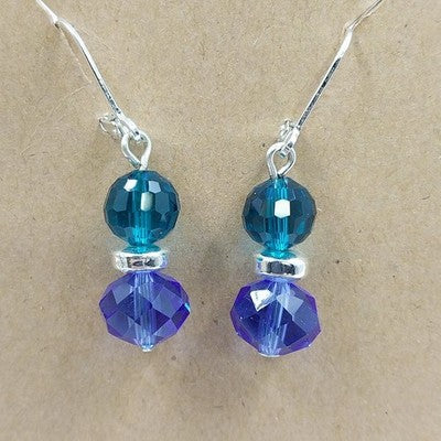 Silver tone dangle earrings with cobalt blue faceted beads and leverback