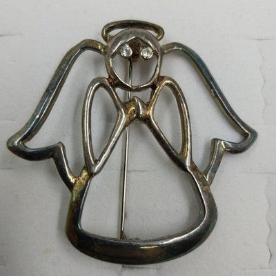 Silver tone open work angel brooch with rhinestone eyes and halo