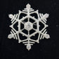 Silver tone snowflake brooch with clear faceted rhinestones