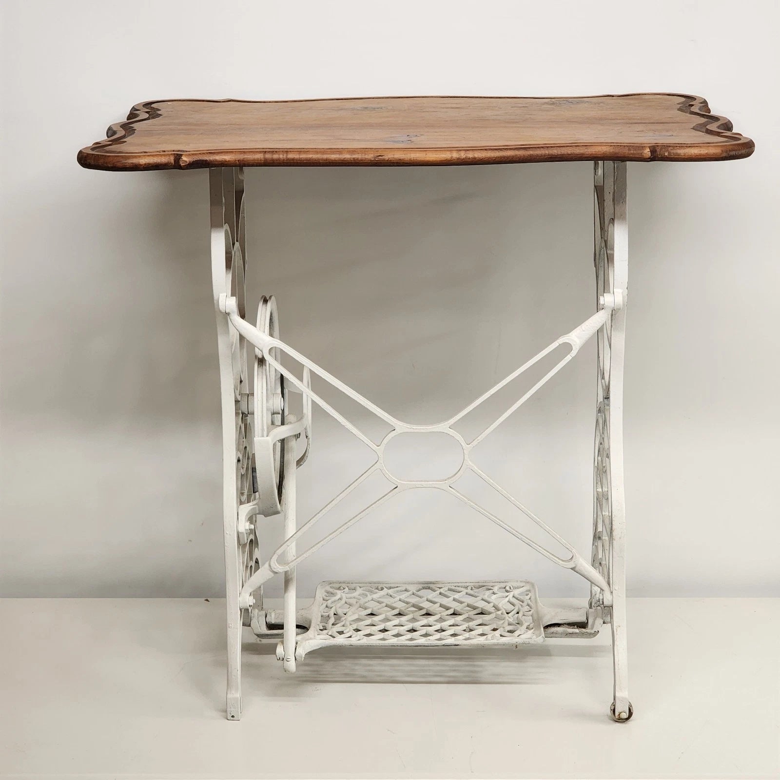 Antique Singer treadle sewing machine table with cast iron base and wood top