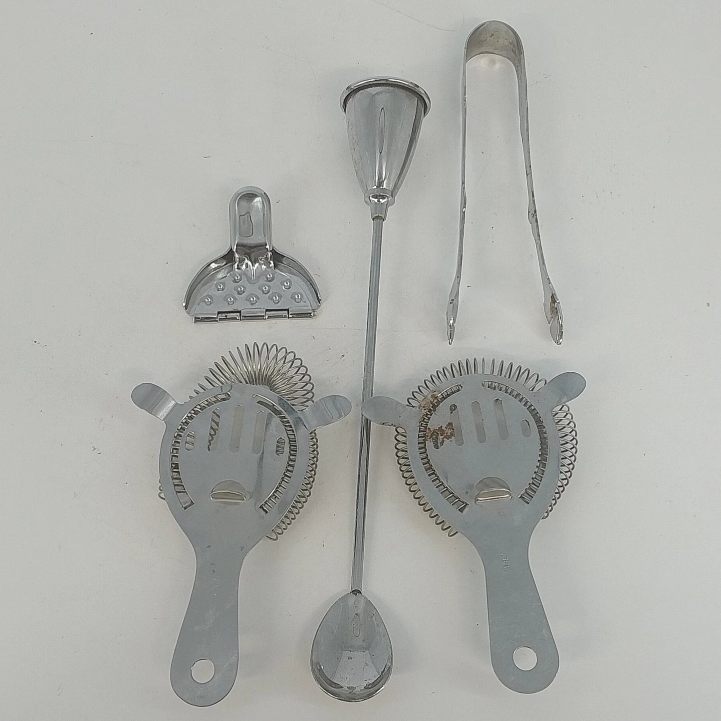 Stainless steel bartender tools with strainers jigger and tongs
