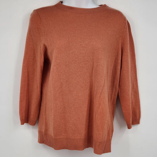 Talbots Petite burnt orange 100% cashmere crewneck sweater with long sleeves and ribbed trim.