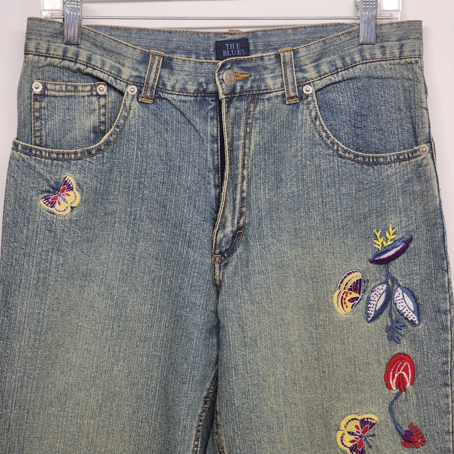 Blue denim jeans with butterfly and flower embroidery