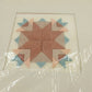 Finished Prairie Tracks cross stitch with matting, unframed