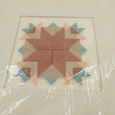 Finished Prairie Tracks cross stitch with matting, unframed