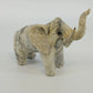 Gray trunk up lucky elephant figurine sculpture