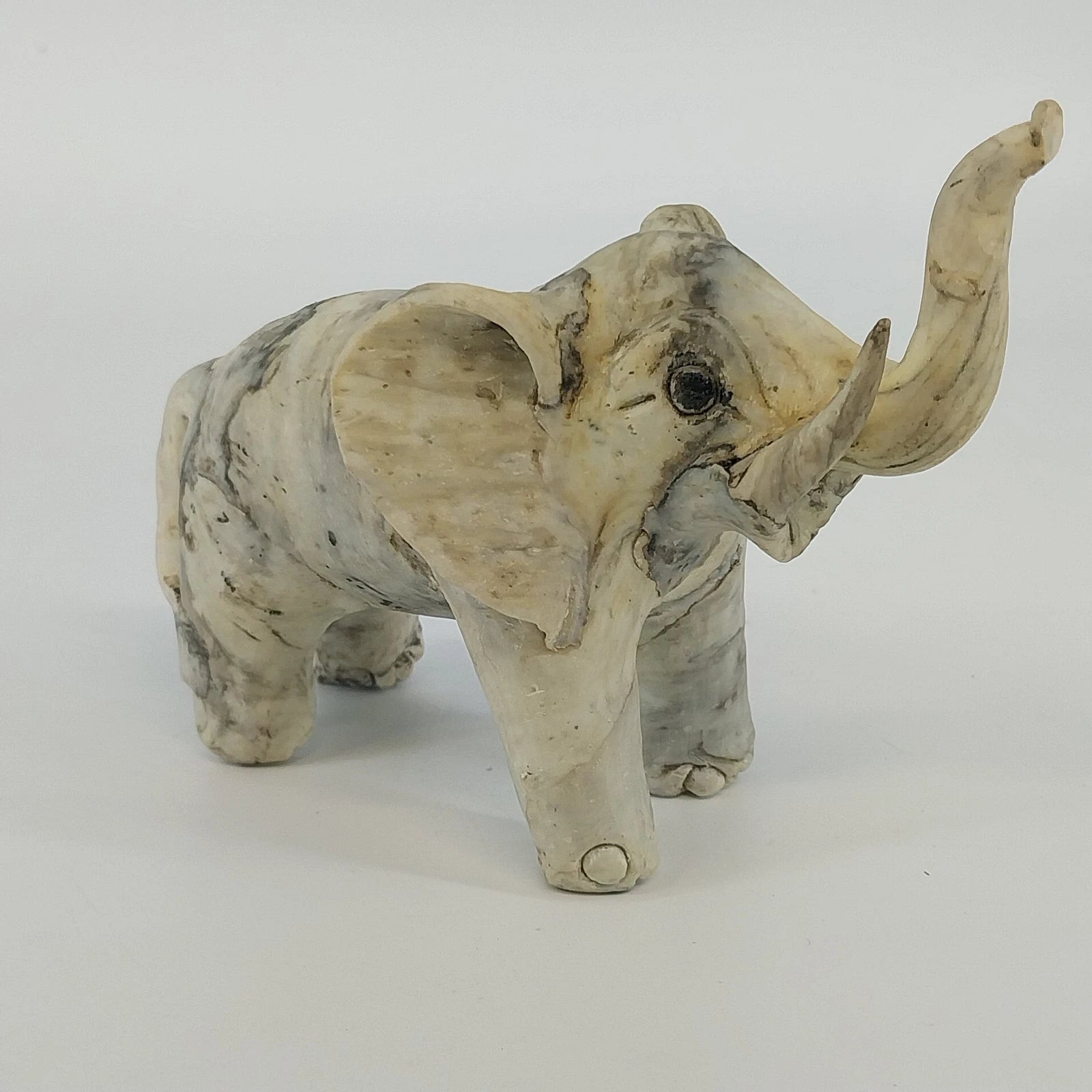 Gray trunk up lucky elephant figurine sculpture