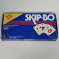 Vintage 1986 Skip-Bo card game in its original blue box with red and white stripes and classic logo.
