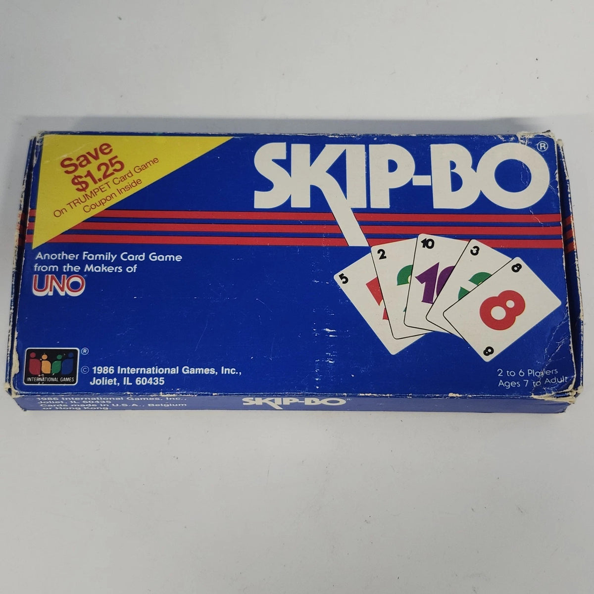 Vintage 1986 Skip-Bo card game in its original blue box with red and white stripes and classic logo.