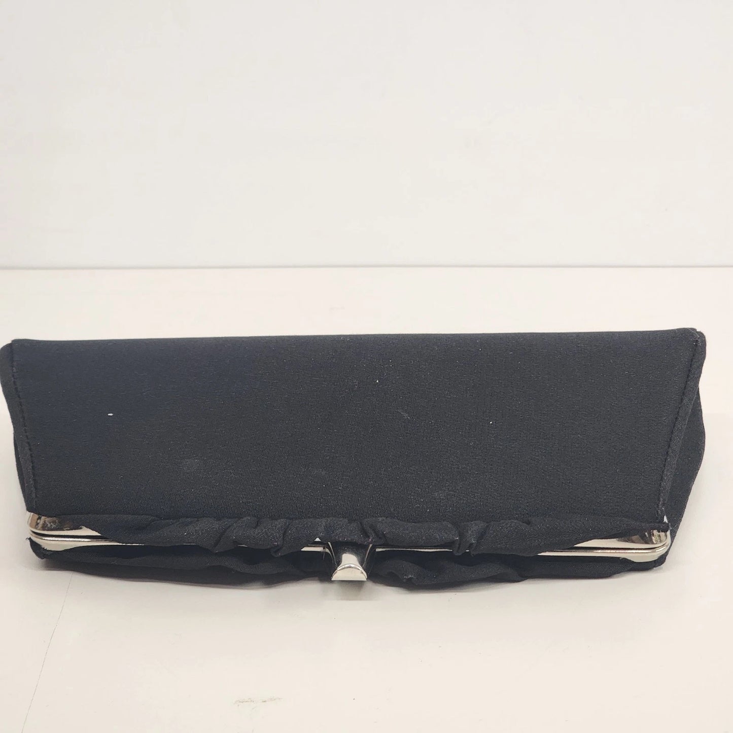 Vintage black evening clutch bag with canvas exterior and leather interior