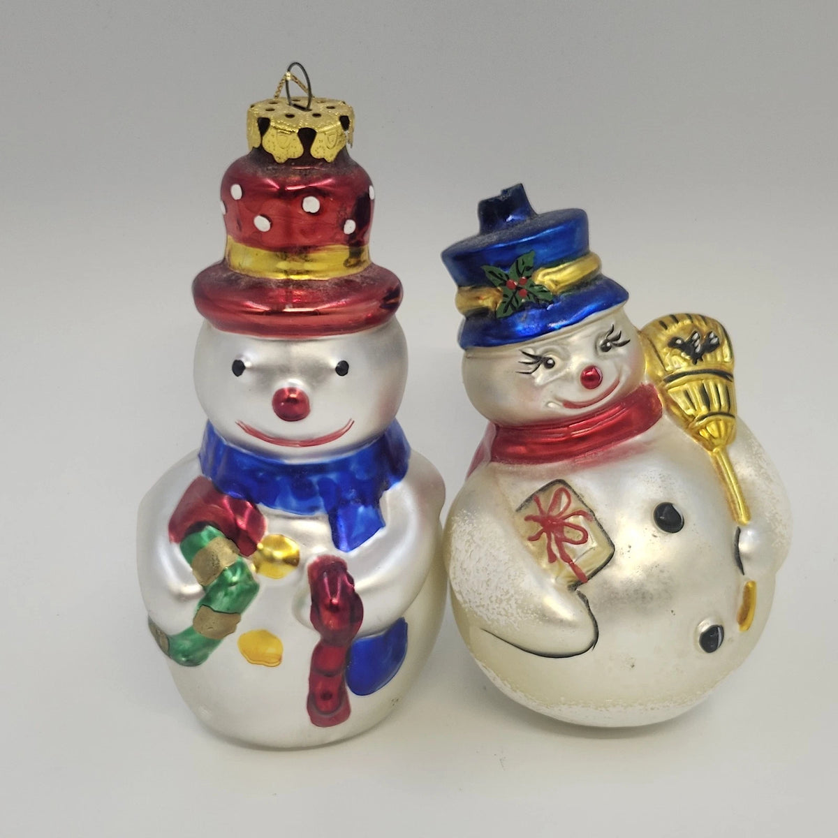 Set of two vintage blown glass snowman Christmas ornaments with colorful hats and scarves