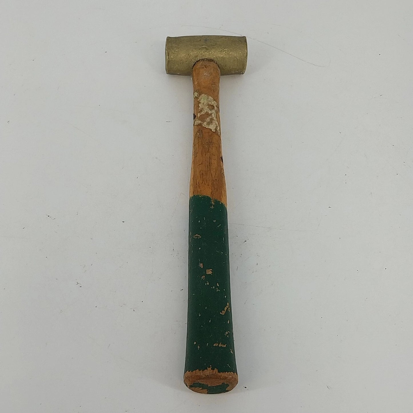 Vintage brass head mallet hammer with wood handle and green grip