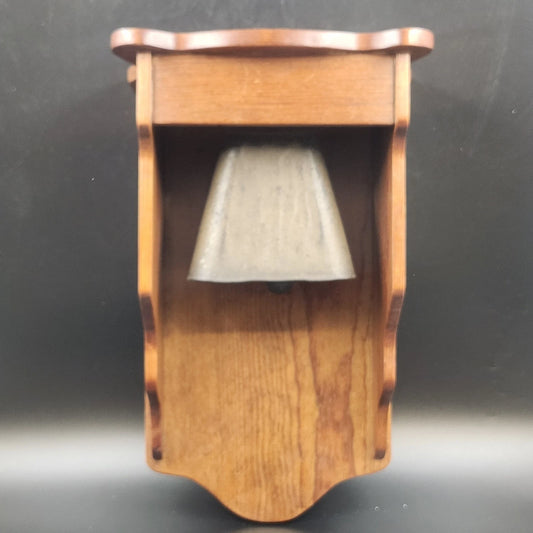 Vintage brass dinner bell with wooden wall mount and display shelf