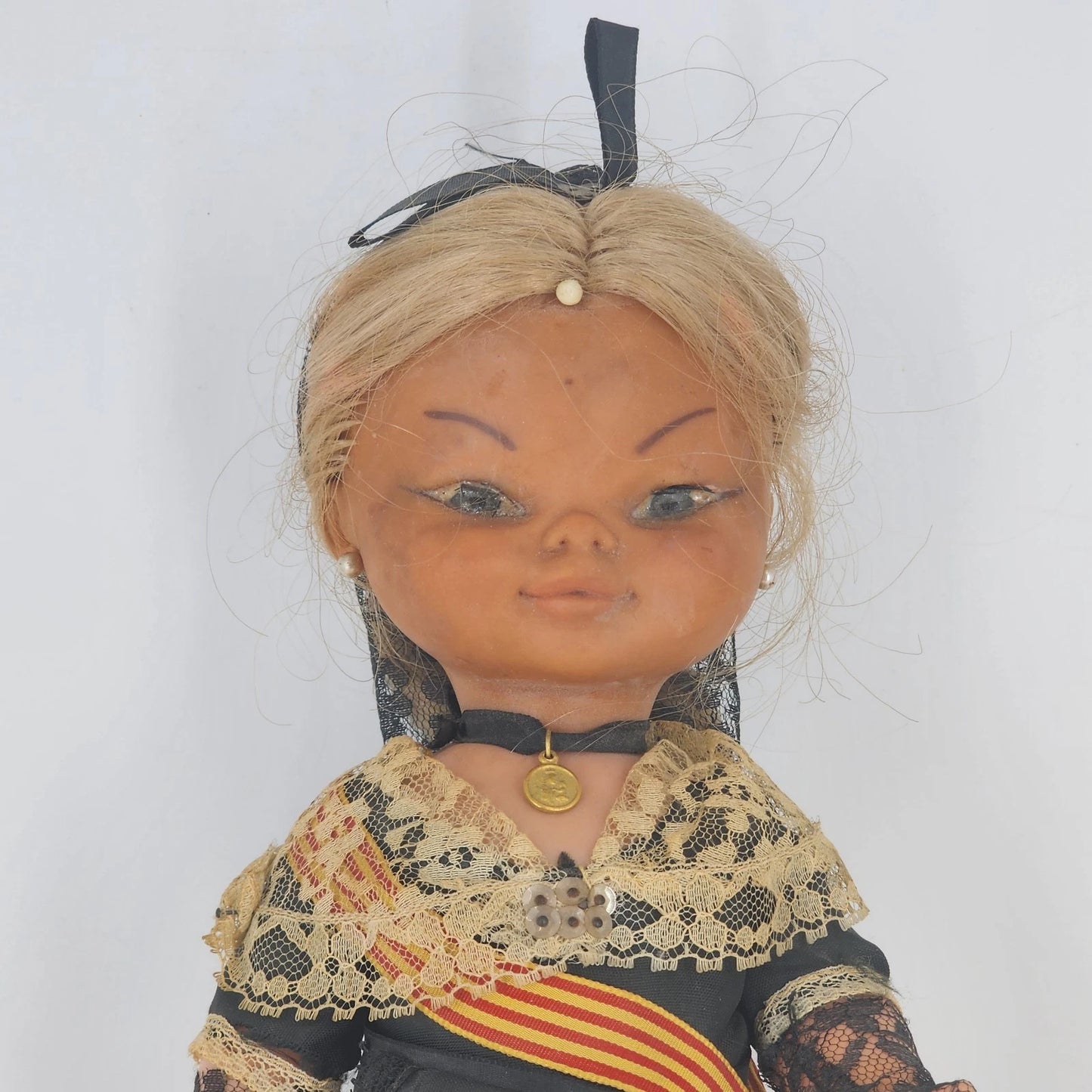 Vintage Catalonia Spain souvenir doll wearing traditional folk attire with lace shawl and espadrilles
