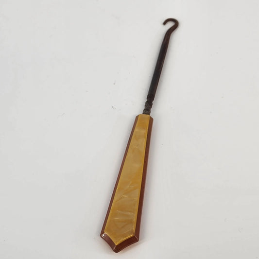 Vintage button hook with cream celluloid handle and steel hook