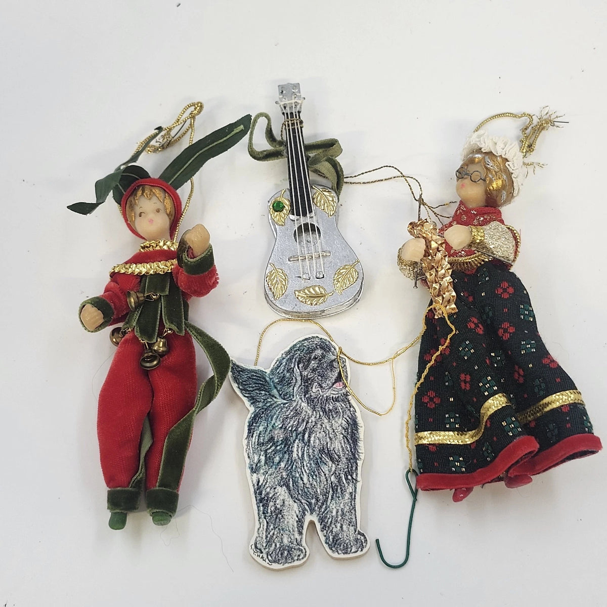 Vintage lot of four Christmas ornaments with felt elf, musician, mandolin, and dog