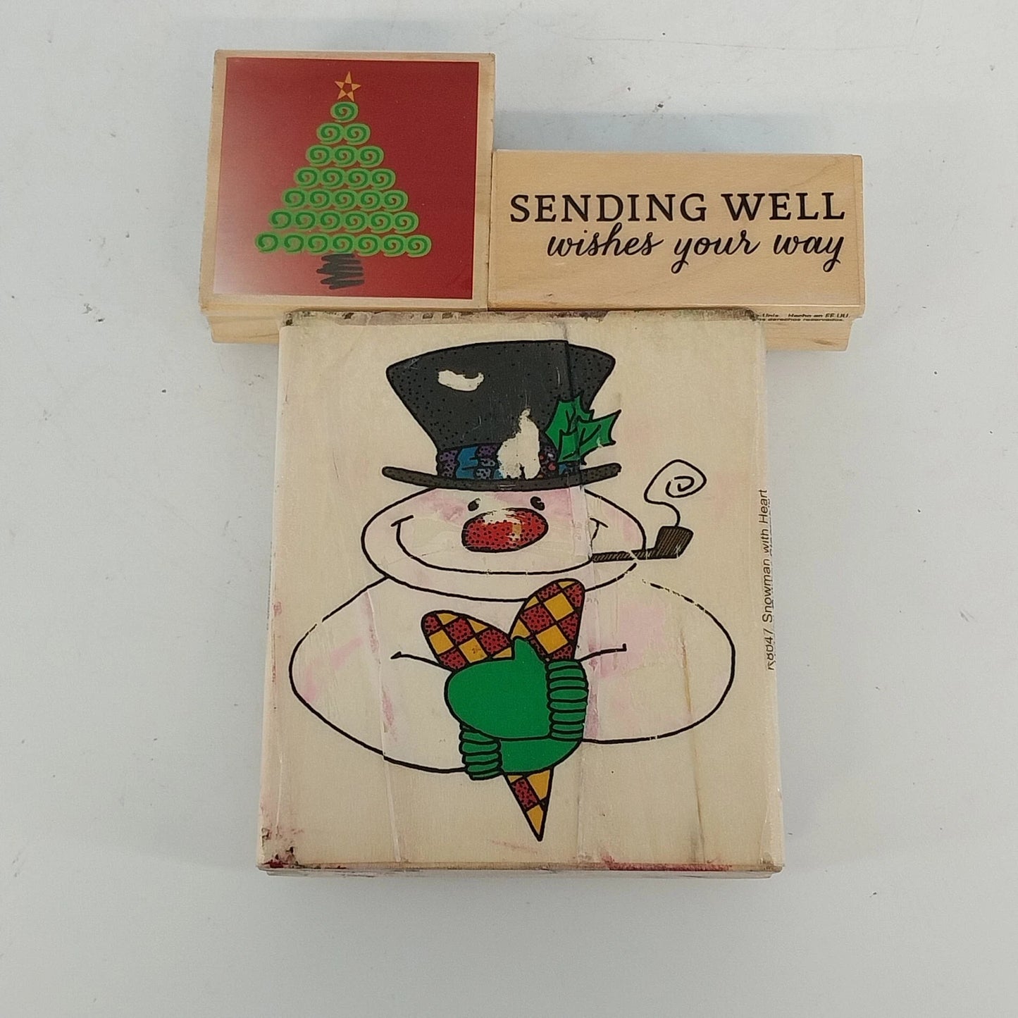 Vintage wooden rubber stamps with snowman and Christmas tree designs
