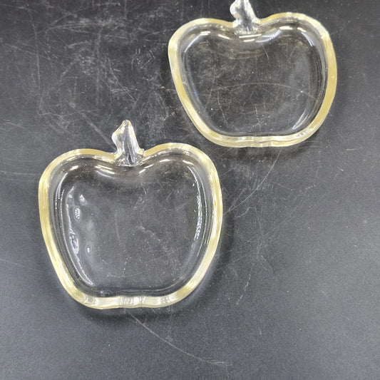 Pair of clear glass apple-shaped trinket dishes with molded stems