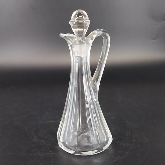 Vintage clear glass cruet bottle with ribbed panels and glass stopper