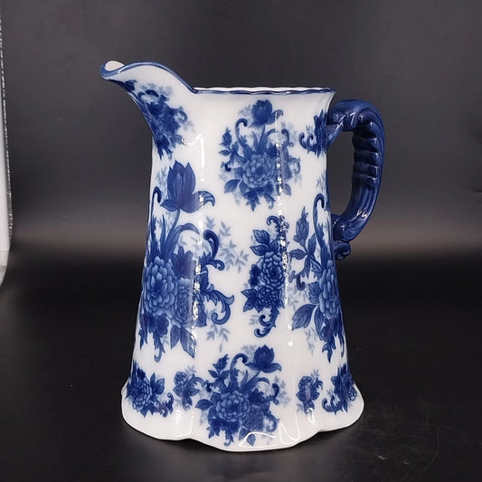 Vintage Cracker Barrel blue and white floral porcelain pitcher with sculpted blue handle