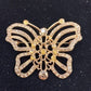 Vintage gold tone butterfly brooch with clear and amber rhinestones