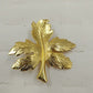Vintage gold tone tree leaf brooch pin with detailed autumn design
